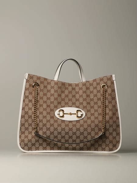 gucci bimba|white Gucci shopping bag.